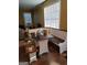 Cozy dining area with built-in bench seating, flooded with natural light from large windows at 3551 Northgate Cv, Ellenwood, GA 30294