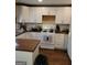 Bright kitchen with white cabinets, modern appliances, and ample counter space for meal preparation at 3551 Northgate Cv, Ellenwood, GA 30294