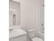 Clean bathroom with a single sink, toilet, and shower-tub combination at 633 Kimberwick Dr, Locust Grove, GA 30248