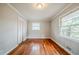 Bedroom featuring hardwood floors, a closet and natural light at 1690 Carter Rd, Decatur, GA 30032