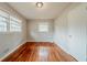 Bedroom with hardwood floors and two windows for lots of natural light at 1690 Carter Rd, Decatur, GA 30032