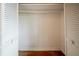 Empty closet featuring white louvered doors and hardwood flooring at 1690 Carter Rd, Decatur, GA 30032