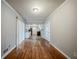 Dining room featuring hardwood floors with view of kitchen with white cabinets at 1690 Carter Rd, Decatur, GA 30032