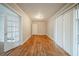 Spacious living room featuring hardwood floors, glass doors, and neutral paint at 1690 Carter Rd, Decatur, GA 30032