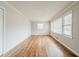 Living room showcasing hardwood floors and natural light from multiple windows at 1690 Carter Rd, Decatur, GA 30032