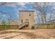 Large backyard featuring wood fence and an elevated deck and access to back entry at 3040 Washington Rd, Atlanta, GA 30344