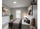 Staged bedroom with modern art, houseplant, and sleek decor at 3040 Washington Rd, Atlanta, GA 30344