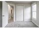 Neat bedroom featuring double closet doors and a window with natural light at 3040 Washington Rd, Atlanta, GA 30344