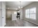 Bright dining space with hardwood floors, natural light, and seamless access to the kitchen at 3040 Washington Rd, Atlanta, GA 30344