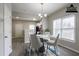 Cozy dining area with modern lighting and an open view of the kitchen at 3040 Washington Rd, Atlanta, GA 30344