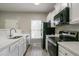 Well-equipped kitchen with white cabinets, modern appliances, and ample counter space at 3040 Washington Rd, Atlanta, GA 30344