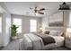 Staged bedroom with large bed, modern décor, and plenty of natural light at 3040 Washington Rd, Atlanta, GA 30344