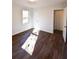 This bedroom features hardwood floors, light walls, and a window to let in natural light at 3601 Orchard Cir, Decatur, GA 30032