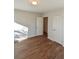 Clean bedroom with wood-look flooring, natural light, and ample closet space at 3601 Orchard Cir, Decatur, GA 30032