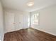 Bright bedroom with hardwood floors, fresh paint, and large windows at 3601 Orchard Cir, Decatur, GA 30032