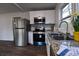 Close up of kitchen features including stainless appliances, granite countertops, and a window at 3601 Orchard Cir, Decatur, GA 30032