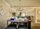 Inviting dining room with modern lighting and a gray table at 5509 Park Place South, Atlanta, GA 30349