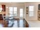 Bright breakfast nook with wood floors, and lots of windows overlooking the backyard at 6188 Riddle Ct, Douglasville, GA 30134