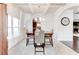 Elegant dining room with coffered ceilings, chandelier and ample natural light at 6188 Riddle Ct, Douglasville, GA 30134