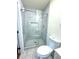 Bathroom featuring a glass-enclosed stand-up shower with a white and gray tile surround at 2182 Rosewood Rd, Decatur, GA 30032