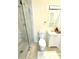 Modern bathroom with a glass-enclosed shower, white vanity, and light-colored tile floors at 2182 Rosewood Rd, Decatur, GA 30032