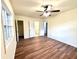 Bedroom features wood floors, a ceiling fan, and a window letting in lots of natural light at 2182 Rosewood Rd, Decatur, GA 30032