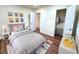Cozy bedroom with a soft grey bed, colorful decor, and stylish storage at 2182 Rosewood Rd, Decatur, GA 30032