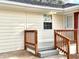 The home's side entrance features a small deck with wood railing at 2182 Rosewood Rd, Decatur, GA 30032