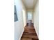 Hallway with hardwood floors, white trim, and doors leading to various rooms at 2182 Rosewood Rd, Decatur, GA 30032