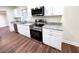 Close-up of the renovated kitchen featuring stainless steel appliances and granite countertops at 2182 Rosewood Rd, Decatur, GA 30032