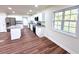 Bright kitchen featuring white cabinets, granite counters, and modern appliances at 2182 Rosewood Rd, Decatur, GA 30032