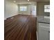 Spacious living room featuring granite counters and warm laminate flooring at 2182 Rosewood Rd, Decatur, GA 30032