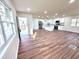 Open-concept living space flowing into bright kitchen and back patio door at 2182 Rosewood Rd, Decatur, GA 30032