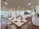 Open floor plan with dining and living space flowing into a bright kitchen at 2182 Rosewood Rd, Decatur, GA 30032