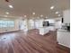 Open floor plan with wood floors flowing into a bright modern kitchen at 2182 Rosewood Rd, Decatur, GA 30032