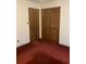 Bedroom with a wood closet and wood-slatted closet doors at 3315 Canterbury Trl, Rex, GA 30273