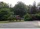 View of home showing mature trees and foliage at 3315 Canterbury Trl, Rex, GA 30273