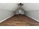 Bright and open finished attic space with updated flooring and a ceiling fan at 3650 Burnt Hickory Dr, Dacula, GA 30019