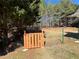 Fenced backyard with a gate, leading to a wooded area at 3650 Burnt Hickory Dr, Dacula, GA 30019