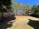 Large backyard featuring a lush lawn and playground equipment, perfect for outdoor activities at 3650 Burnt Hickory Dr, Dacula, GA 30019