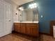 Bathroom with double sink vanity, a large mirror, and tile flooring at 3650 Burnt Hickory Dr, Dacula, GA 30019