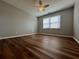 Bedroom features a ceiling fan, and natural light from the large windows at 3650 Burnt Hickory Dr, Dacula, GA 30019