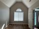 Bedroom with hardwood floors, large window, and light colored walls at 3650 Burnt Hickory Dr, Dacula, GA 30019