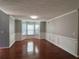 Bright dining room featuring hardwood floors, decorative wall trim, and a large bay window at 3650 Burnt Hickory Dr, Dacula, GA 30019