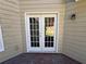 Exterior patio doors with white trim and a view to the backyard beyond the patio at 3650 Burnt Hickory Dr, Dacula, GA 30019