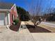 Landscaped walkway and garage side entry of this lovely brick home at 3650 Burnt Hickory Dr, Dacula, GA 30019