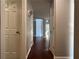 Inviting hallway with hardwood floors and neutral paint, perfect for creating a warm and welcoming entrance to the home at 3650 Burnt Hickory Dr, Dacula, GA 30019