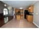 Open kitchen layout with oak cabinets, granite countertops, and stainless steel appliances at 3650 Burnt Hickory Dr, Dacula, GA 30019