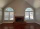 Vaulted living room featuring a brick fireplace and large windows at 3650 Burnt Hickory Dr, Dacula, GA 30019