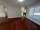 Bright living room featuring hardwood floors, large windows and neutral paint at 3650 Burnt Hickory Dr, Dacula, GA 30019